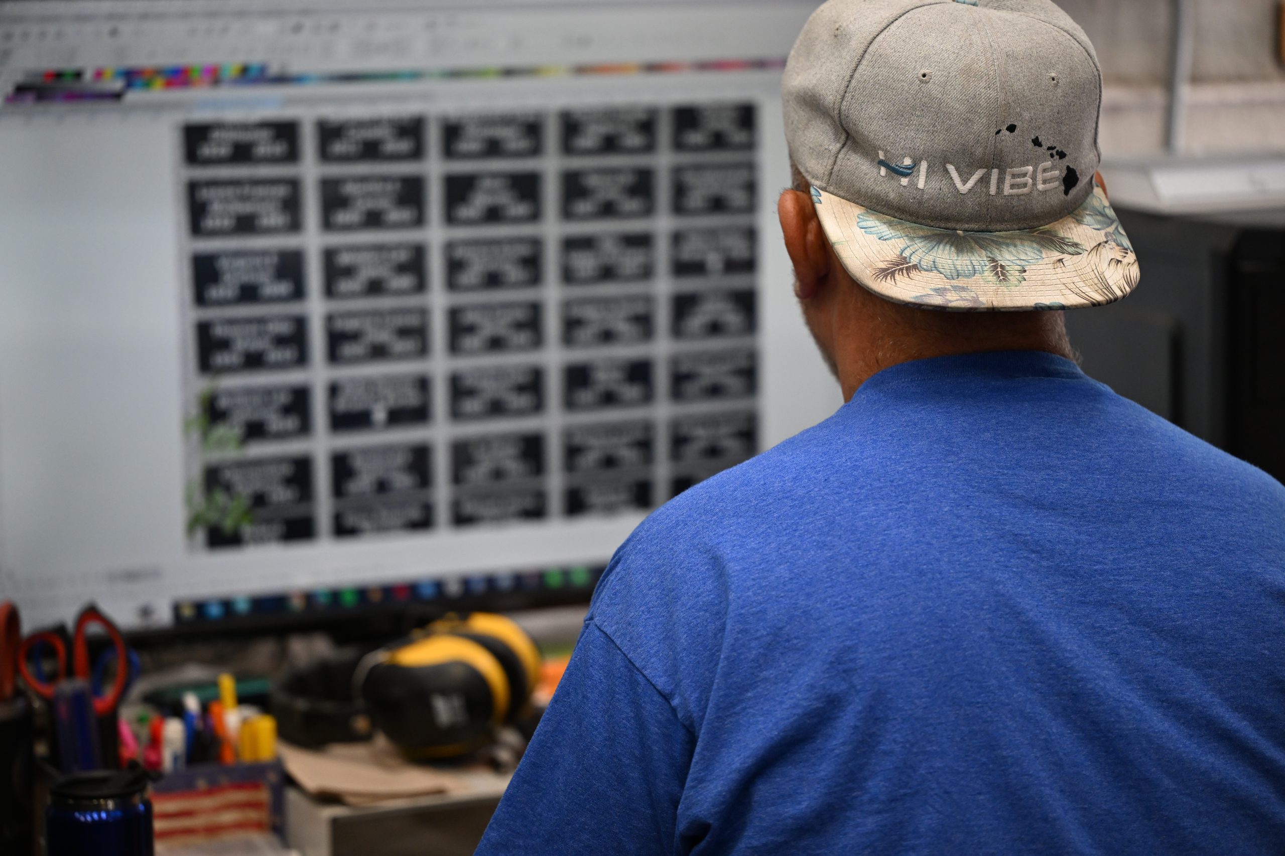 Person working at computer with design software.