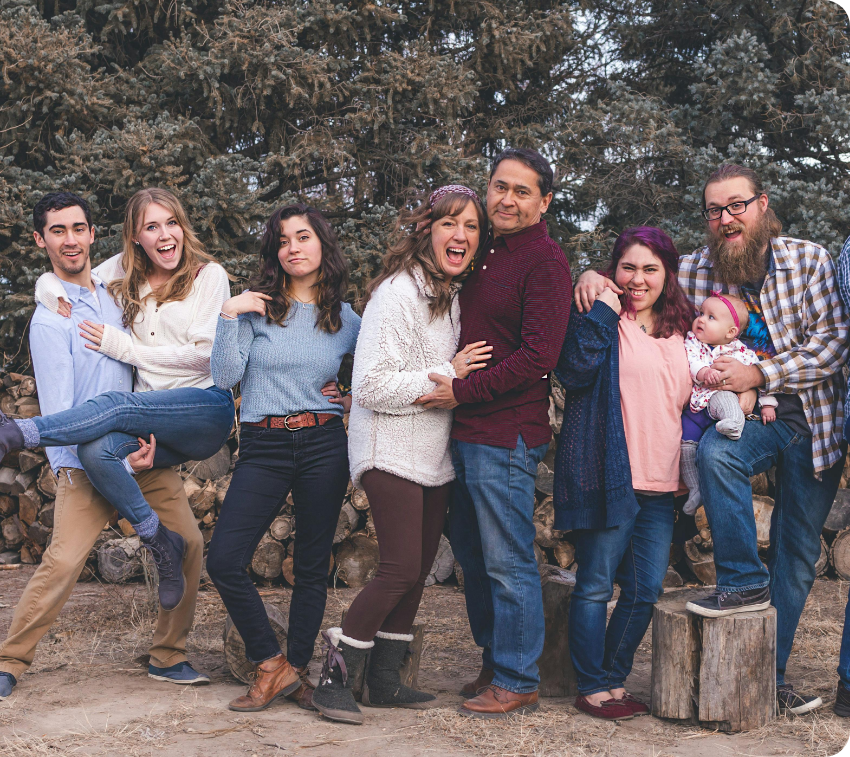 Diverse group smiling outdoors in casual clothing