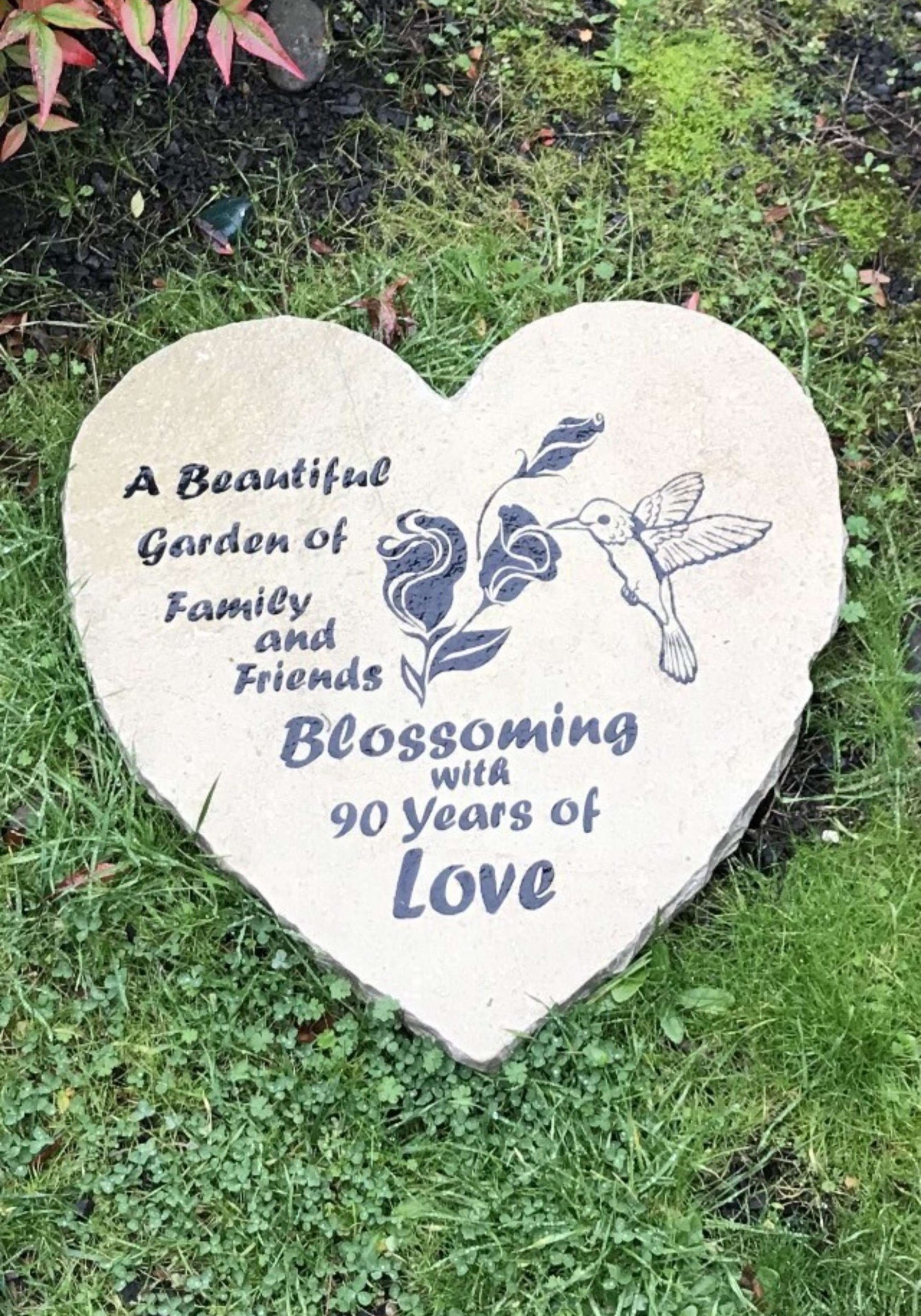 Heart-shaped garden stone celebrating 90 years of love.