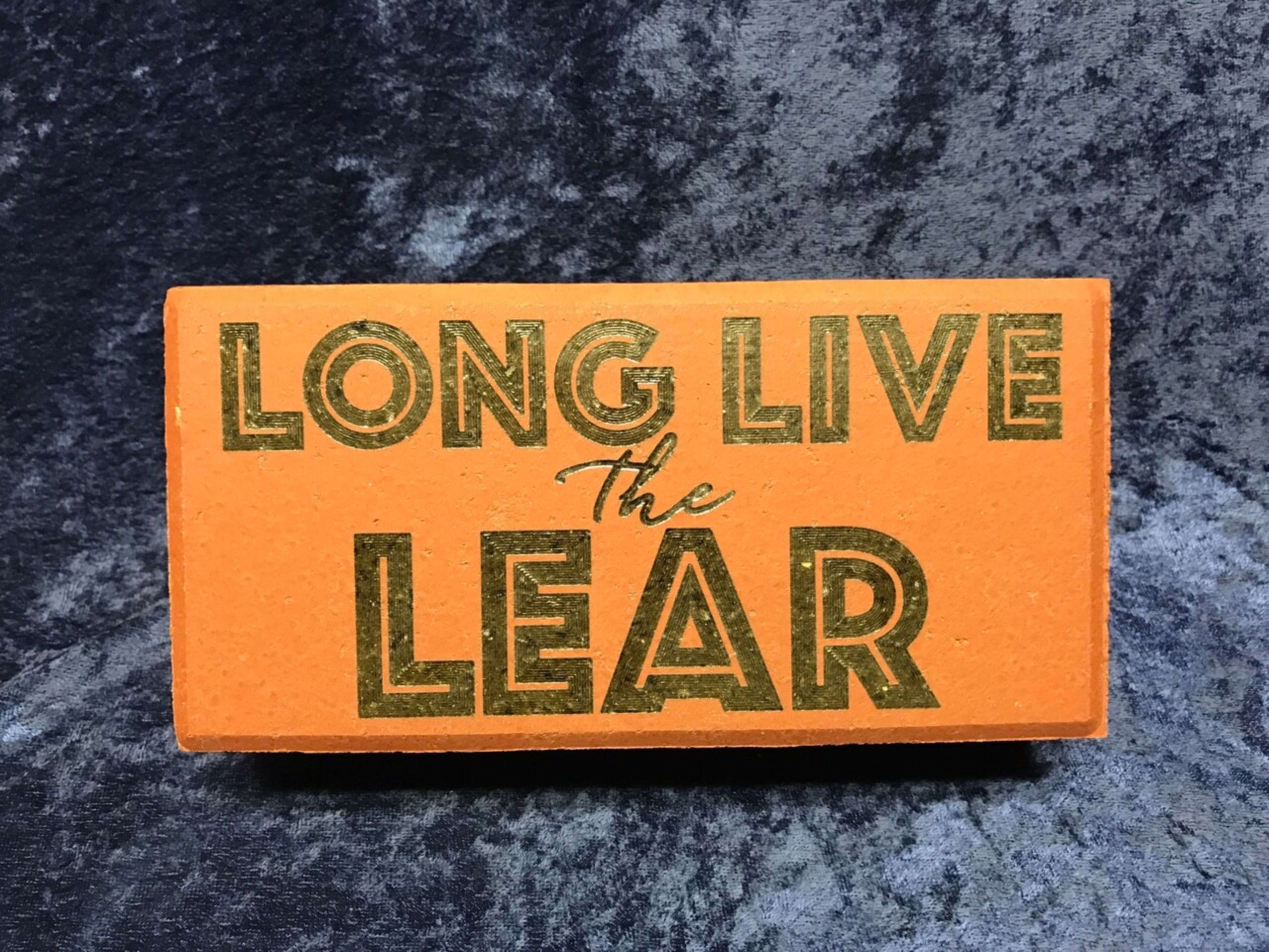 Orange sign with text: Long Live the Lear