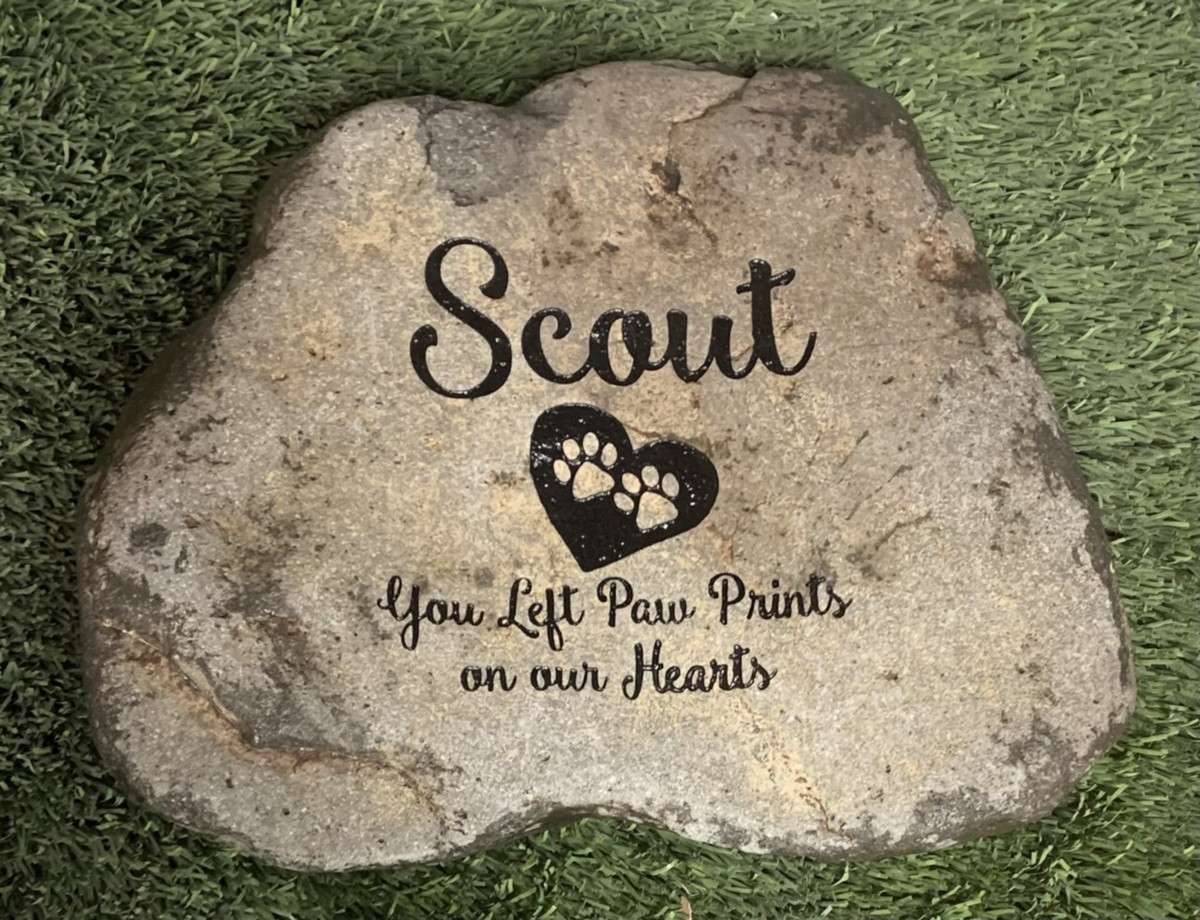 Pet memorial stone on grass
