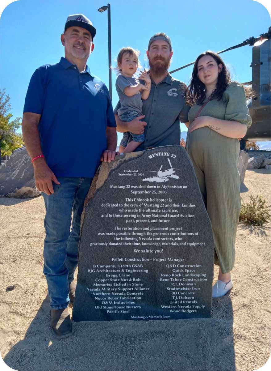 Family standing by Mustang 22 memorial stone.